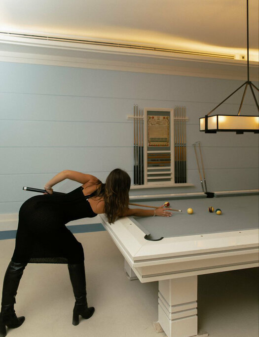 mika is playing billiards
